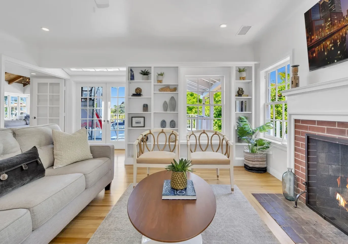 Bright living room with modern furniture and large windows.
